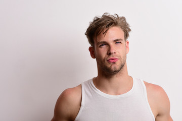 Obraz premium Man with fair hair on white background, copy space.
