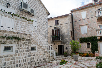 small yard with white houses and balconies