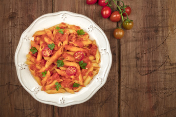 Penne pasta photo with tomato sauce and place for text