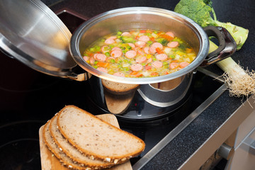 vegetable soup on stove with leek and bread