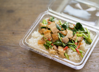 Rice with stir-fried Pork and vegetables Thai spicy food in plastic package