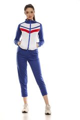 Fototapeta premium young women in blue tracksuits on a white background