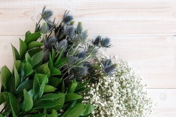 Blue flowers Eryngium on the table