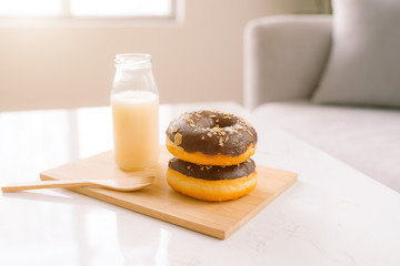 Bottle of milk and donuts, selective focus