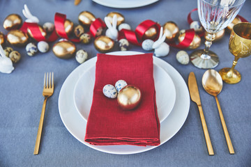 high angle view of easter eggs and napkin on plates