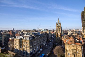 Obraz premium A view of the Skyline of Newcastle-Upon-Tyne, England, with the football stadium (St. James Park) looming large over the surrounding buildings in the centre of the city
