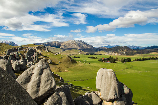 Castle hill rocks and surrounding pastoral countryside near Arthur&rsquo;s pass in South Island, New Zealand