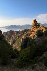 Fototapeta na wymiar Orange rock on the Corsica coast
