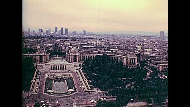 Paris Eiffel Tower aerial view panorama of Paris with Senna river and bridges, Palais de Chaillot palace in the 70s. Jardins du Trocadero gardens. Historic archival footage from 1976 in France.