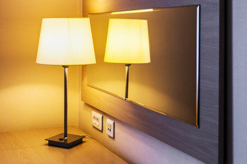 table lamp in the room or hotel room on the background is reflected in the mirror
