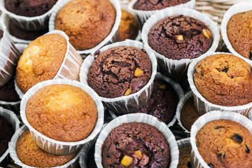 cupcakes and muffins on the counter of a candy store. background