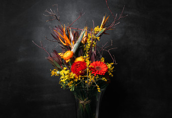 flower Ikibana on a black background, bouquet in a glass vase