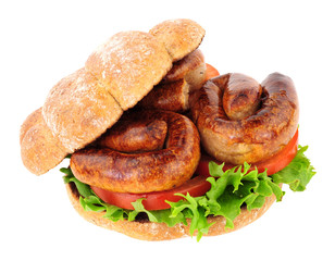 Sausage and salad sandwich roll isolated on a white background