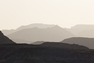 Fototapeta na wymiar mountain silhouette in the Negev desert in Israel at sunset sunrise