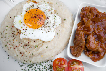 Delicious beef meat with onion, bean side dish and egg