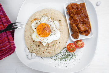 Delicious beef meat with onion, bean side dish and egg