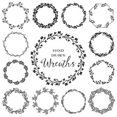 Vintage set of hand drawn rustic wreaths. Floral vector graphic. Nature design elements.