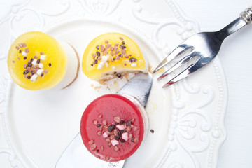 Sweet colourful fruit panna cotta with chocolate decoration