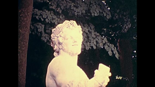 Statues of the Quadriga in the Apollo fountain at Palace of Versailles garden in 1976. Historic archival footage in Paris city of France from 1970s.