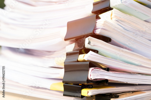 Unfinished Documents Stacks Of Paper Files On Office Desk For