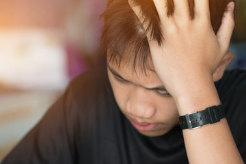 Education test concept : Asian boy student studying stressed headaches for exams in classroom,...