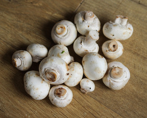 white button Common mushroom (Agaricus bisporus) on wooden table background