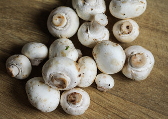 white button Common mushroom (Agaricus bisporus) on wooden table background