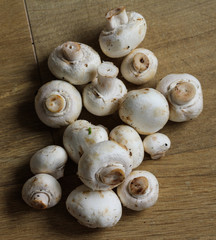 white button Common mushroom (Agaricus bisporus) on wooden table background