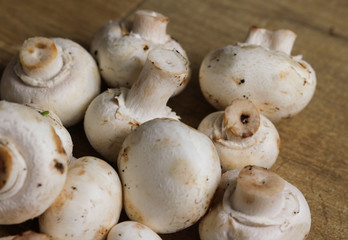 white button Common mushroom (Agaricus bisporus) on wooden table background