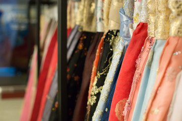 Elegant Dresses Hanging on a Rack. Fashion. Luxury. Traditional