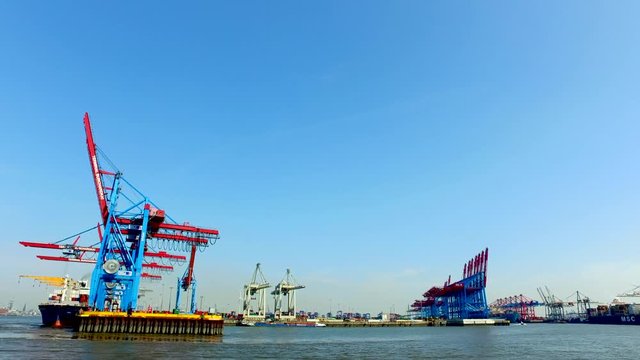 Container ships unload or load their cargo in the Port of Hamburg at the Burchartkai and Eurokai, Germany.