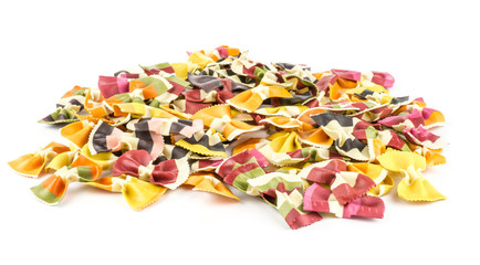 Farfalle pasta with vegetables heap isolated on white background raw classic traditional Italian.