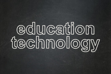 Fototapeta premium Studying concept: text Education Technology on Black chalkboard background