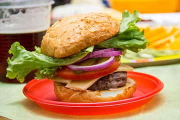 tasty hamburger with fresh vegetables. Homemade burger