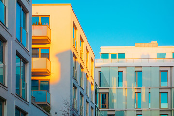 green colored apartment houses with modern facade