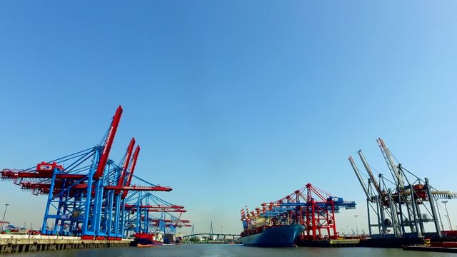 Container ships unload or load their cargo in the Port of Hamburg at the Burchartkai and Eurokai, Germany.