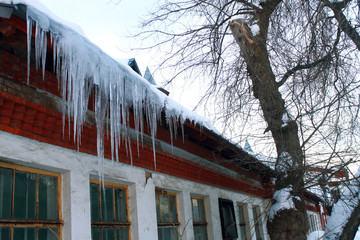 icicles on the roof of the house