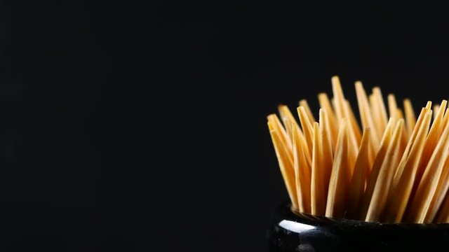 Toothpick on black background