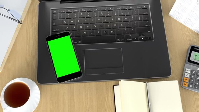 Smart Phone with track green screen on a table