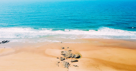 Fototapeta premium Aerial Panoramic Drone View Of Blue Ocean Waves And Beautiful Sandy Beach in Portugal