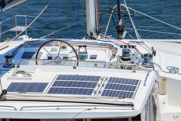 detail of steering wheel and navigation instruments of a sailboat