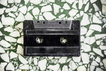Retro cassette tape Isolated on terrazzo texture background