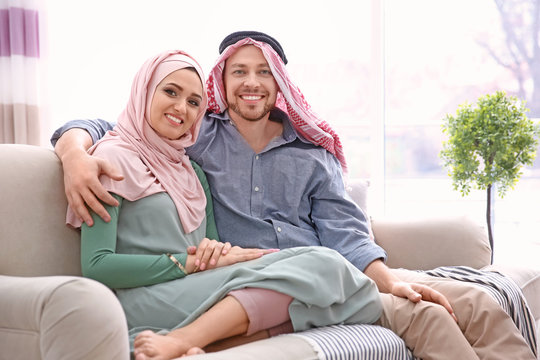 Happy Muslim couple at home