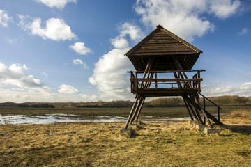 Wooden observation platform on the meadow