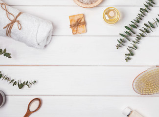 Soap, massage brush, aroma oil and other spa related objects on the white background