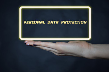 A businessman shows an inscription:PERSONAL DATA PROTECTION