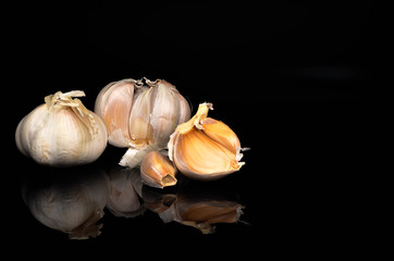 Garlic on a black background.