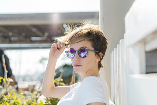 Portrait of woman wearing mirrored sunglasses