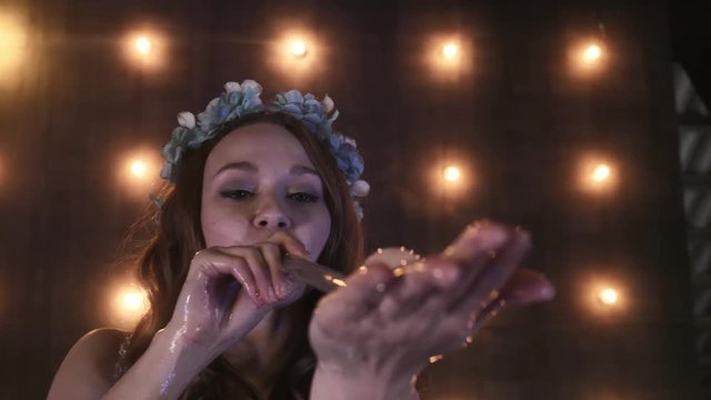 young girl performer in soap bubbles magician show