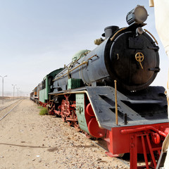 Obraz premium Steam locomotive, still in use, in the desert of Wadi Rum, Jordan